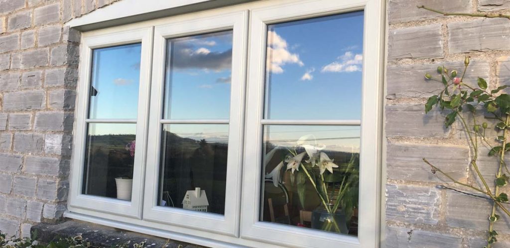 Timber effect uPVC windows in white with georgian bars