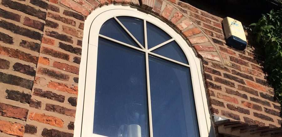 Arched upvc window in cream finish