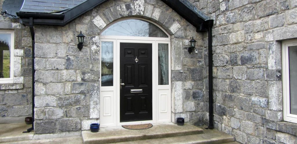 Black entrance door with side panels for extra light