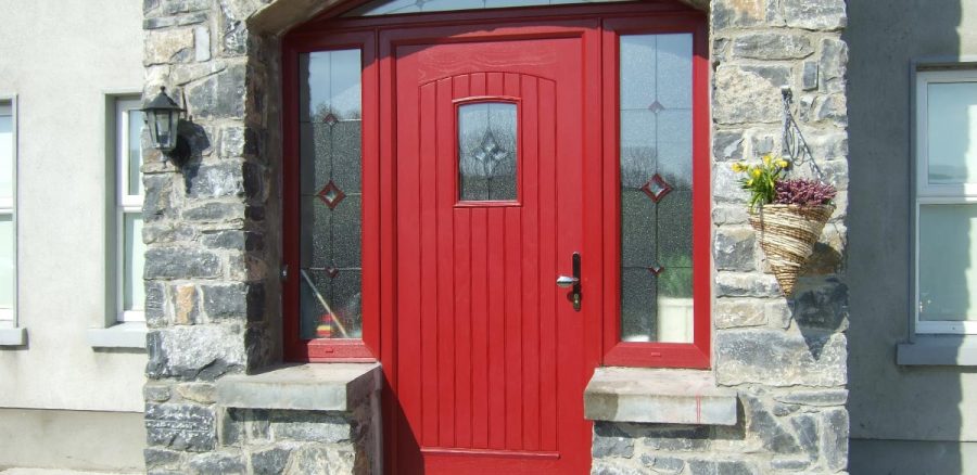 Red composite entrance door with decorative glazing supplied and fitted