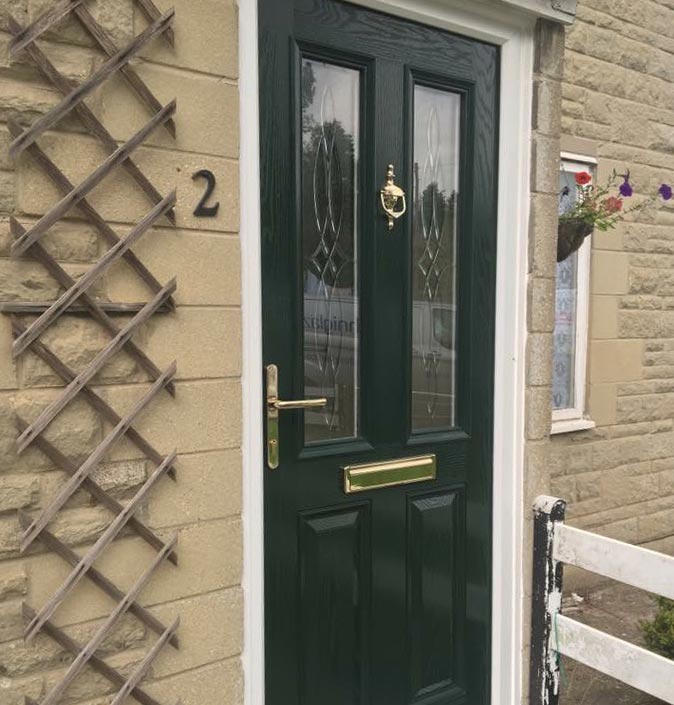 Green composite door with gold hardware