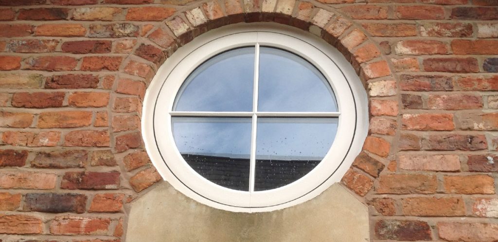 Round upvc timber look window with double glazing