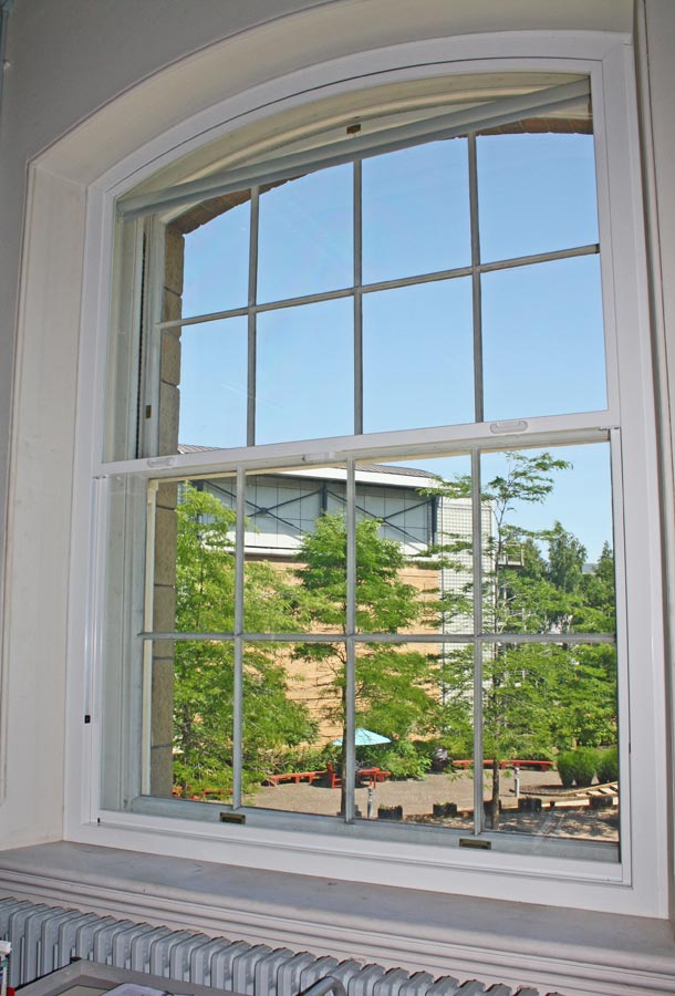 Sliding sash window with secondary glazing fitted internally