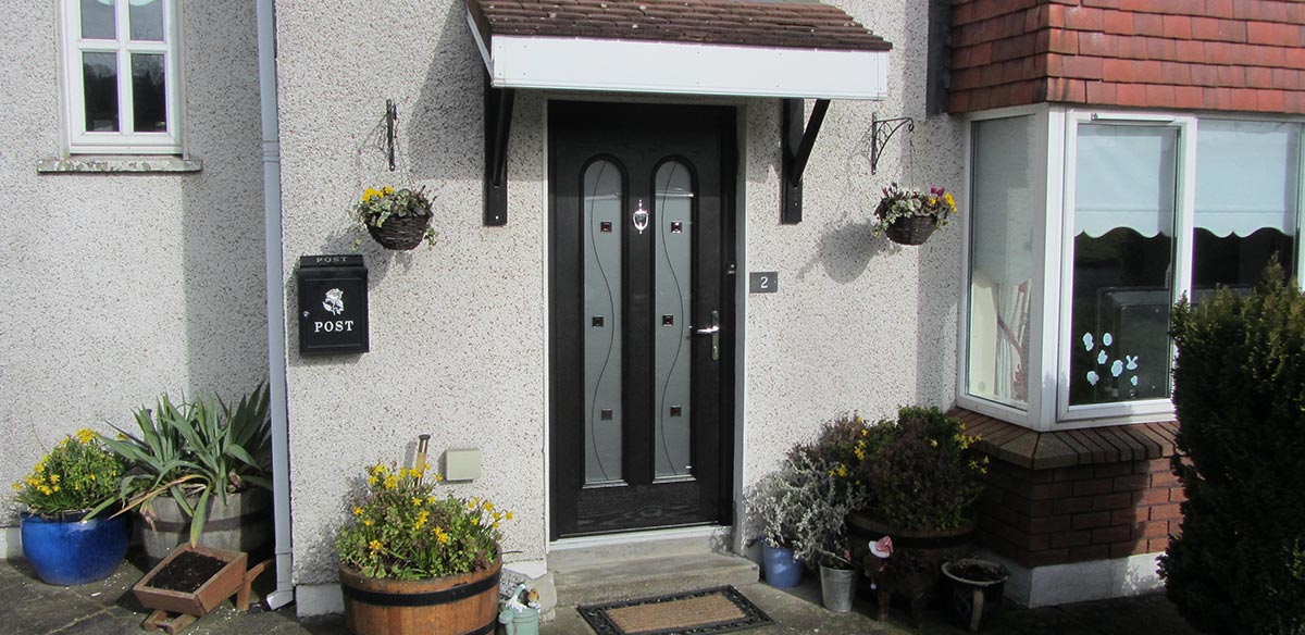 Residential uPVC door canopy over black door