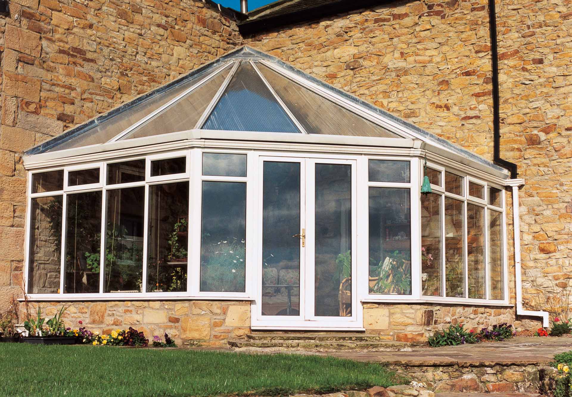 Wok/ Victorian corner fill shaped conservatory with uPVC frame and polycarbonate roof